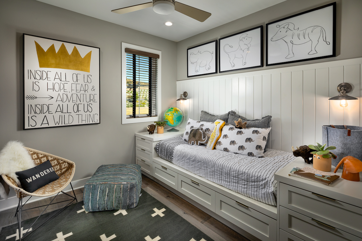 Small bedroom with storage under child's bed.