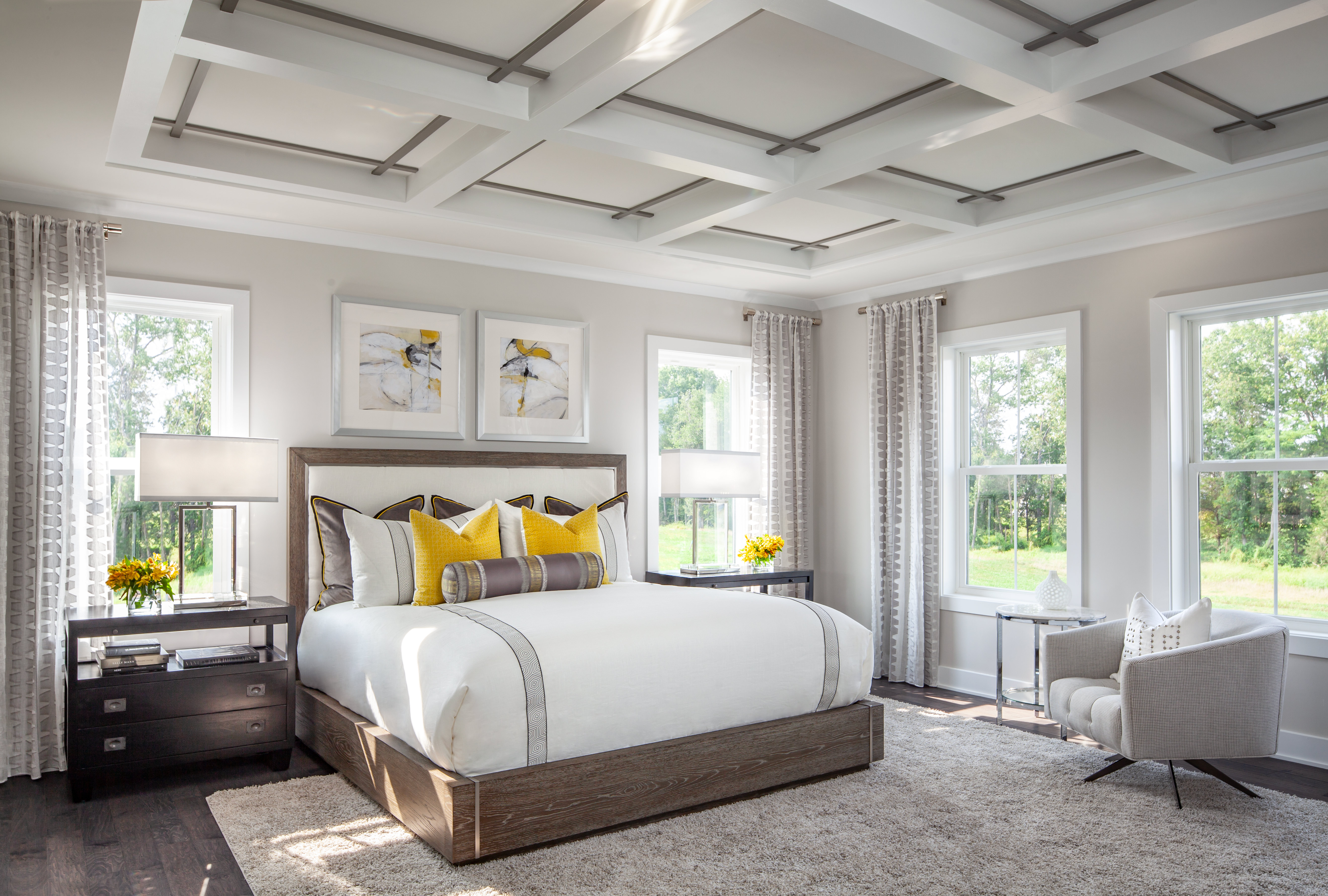 Small bedroom with yellow color accents.