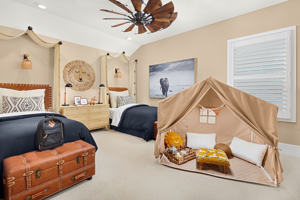 shared bedroom with a play tent.