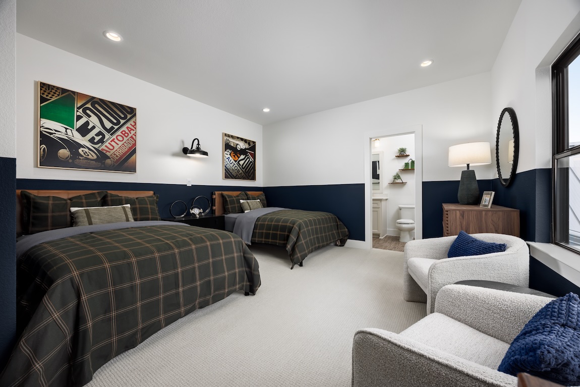 shared bedroom with seating and connected bathroom.