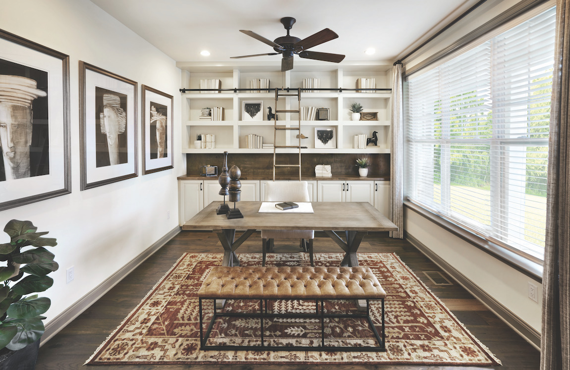 Home office designed with slidable latter and shelving fixture for convenient organization