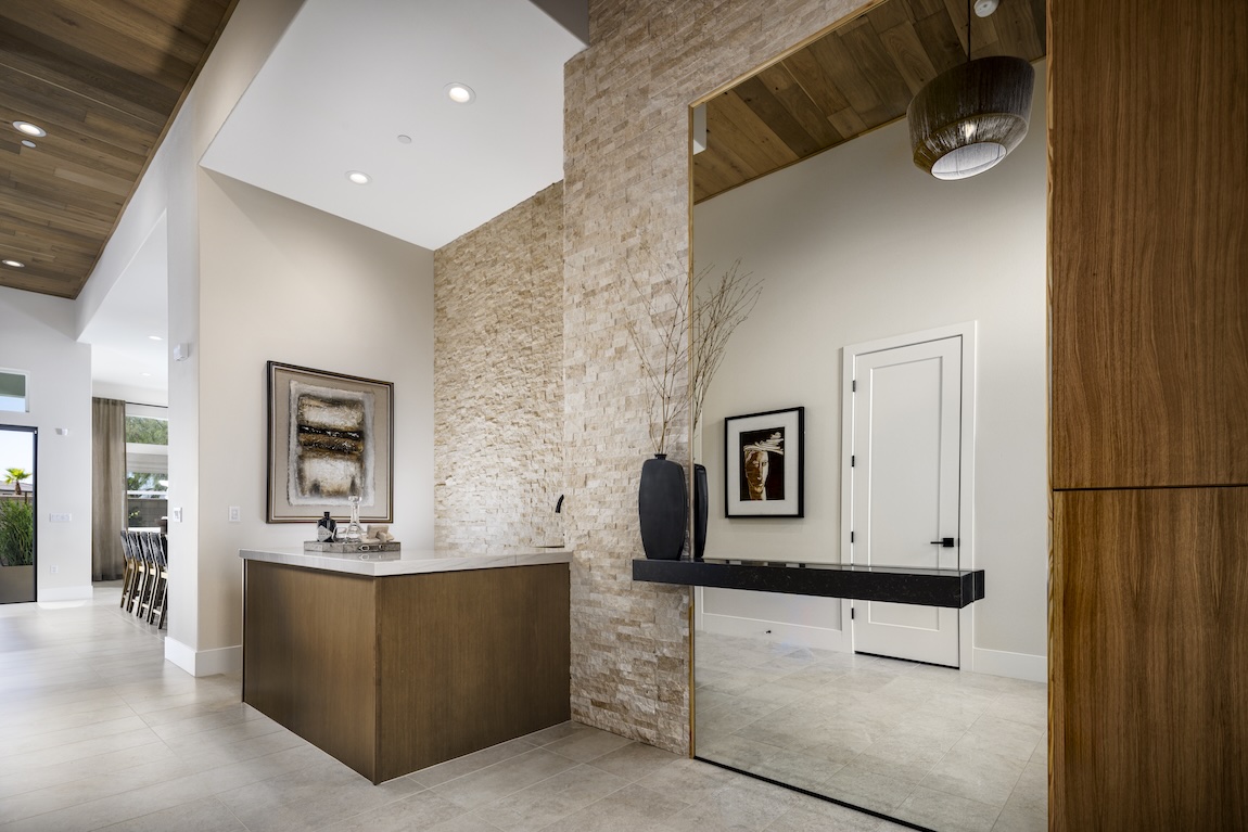 foyer with stone and wood accent wall