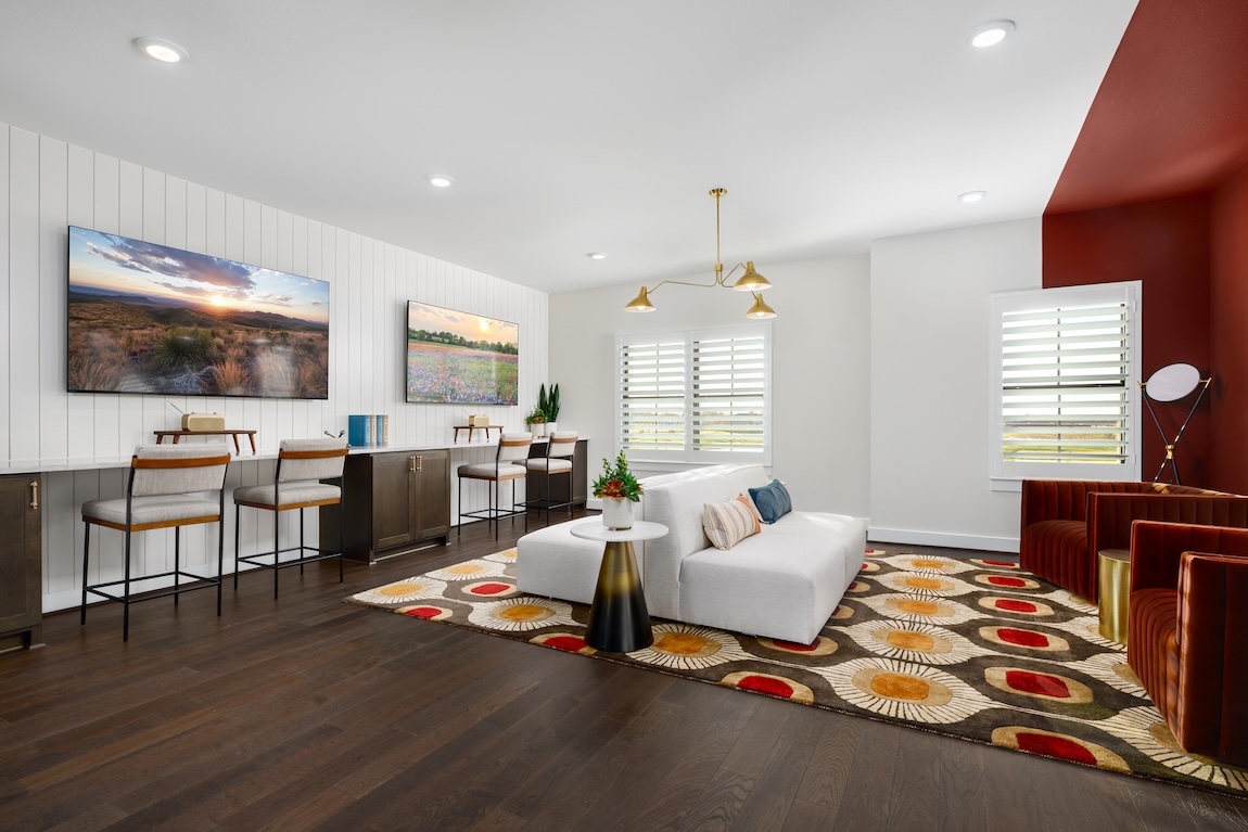 room with shiplap accent wall and red accents