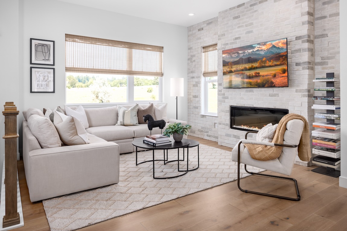 living space with brick accent wall