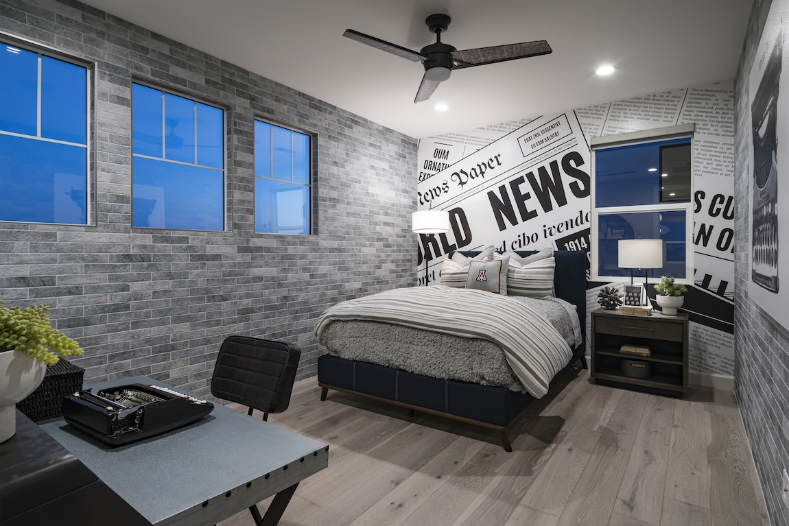 bedroom with a brick accent wall