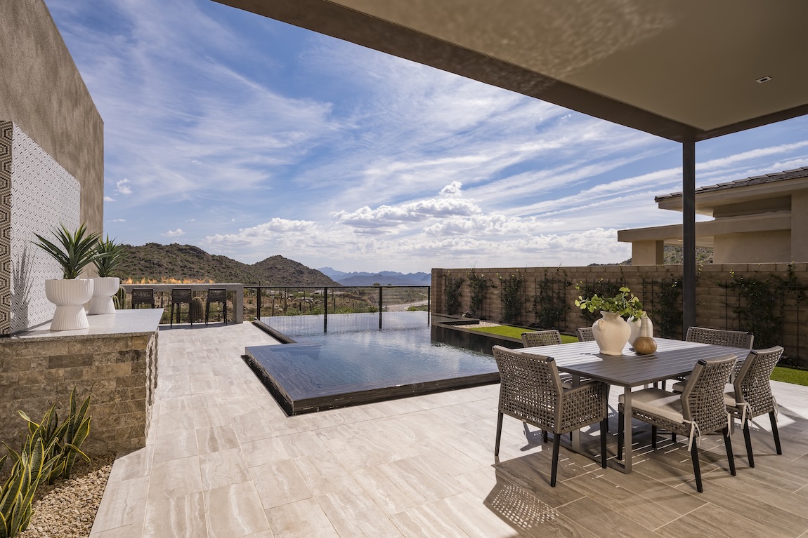 outdoor living space with pool overlooking the mountains