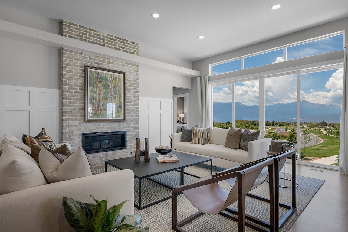 great room overlooking mountain views and greenery