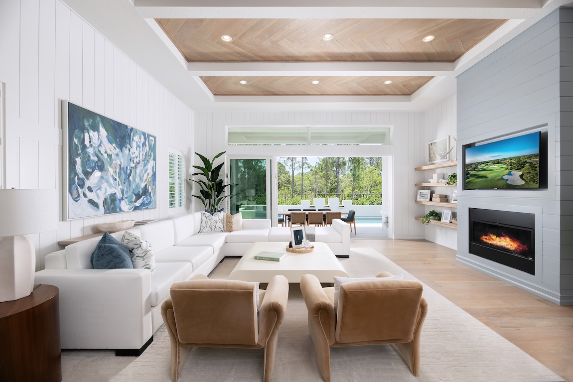 modern living room with white couch and fireplace