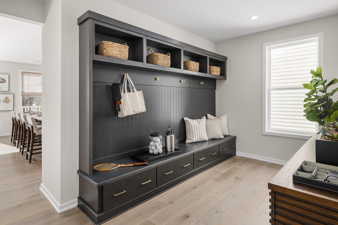 home entryway with storage cubbies and bins