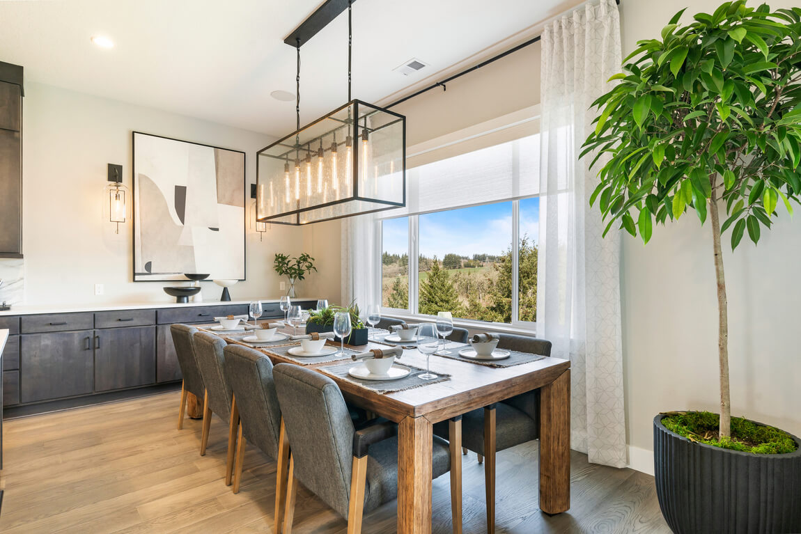 Transitional dining room highlighted by chandelier lighting fixture