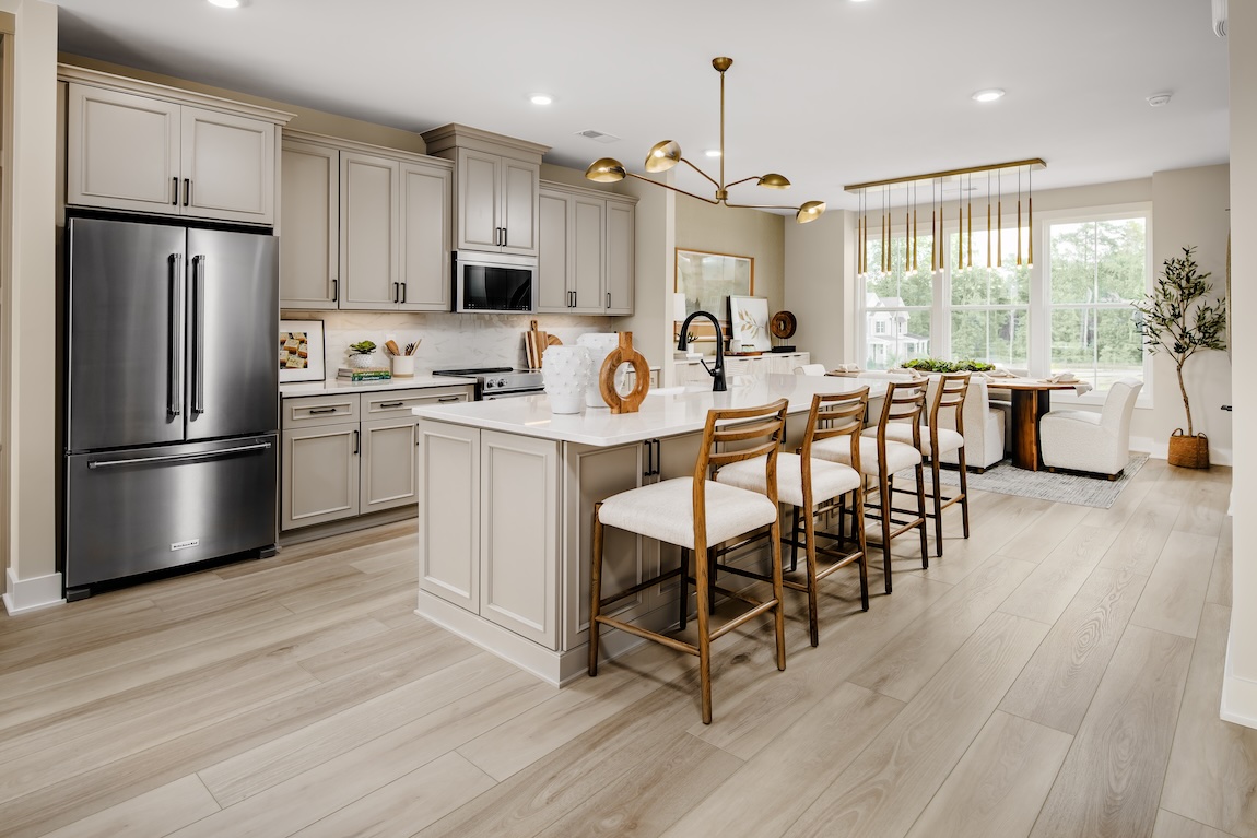 luxe contemporary kitchen design in home at Forestville Village by Toll Brothers in Knightdale, North Carolina