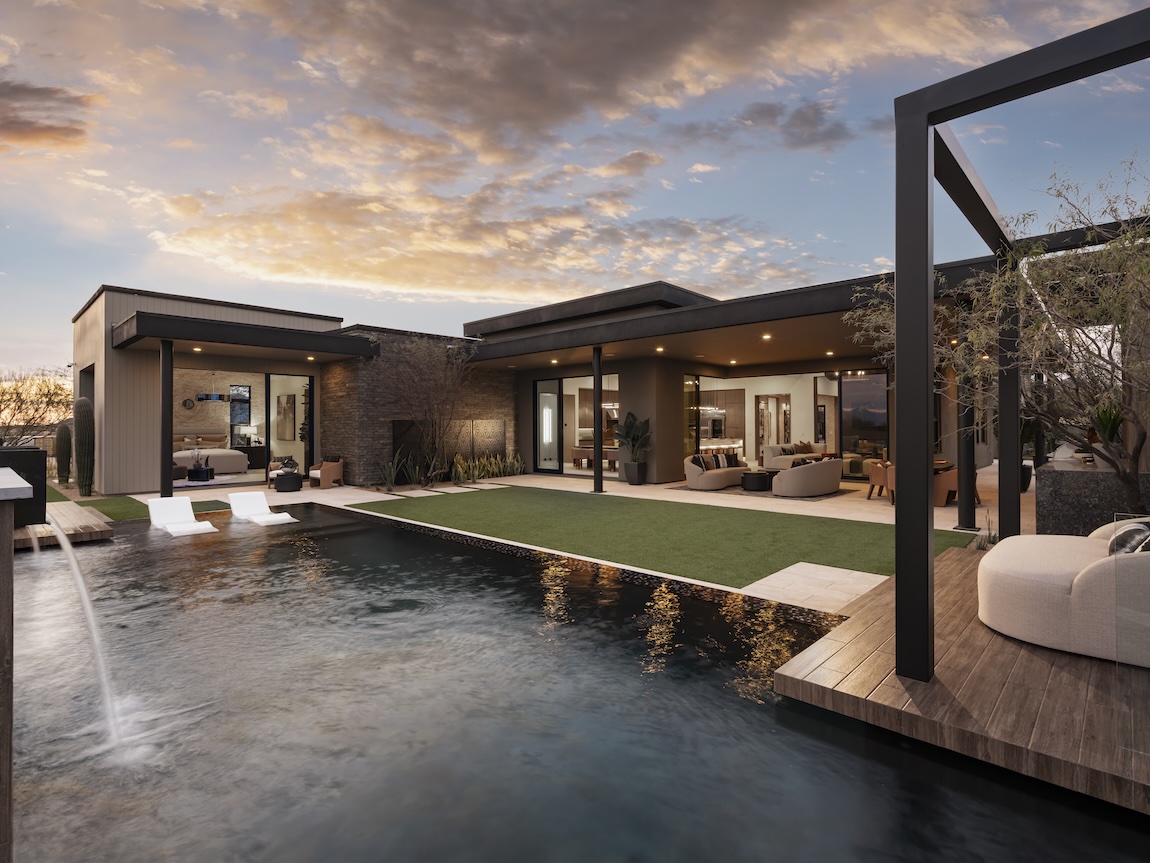 Modern luxury home at sunset with open-concept indoor-outdoor living, a private pool with lounge chairs, water feature, and minimalist desert landscaping.