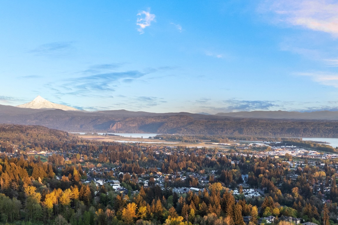 birds eye view of mountains, trees, and river