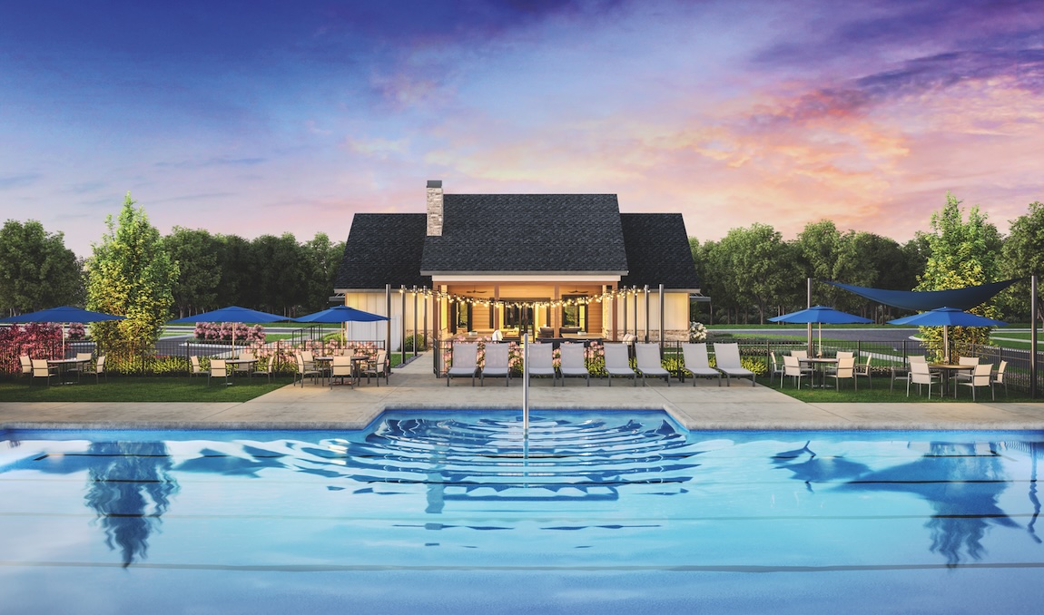 community pool with lounge seating and a clubhouse