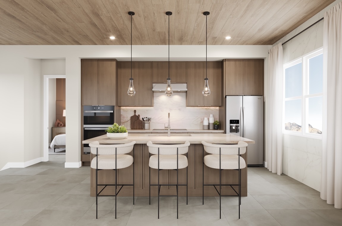 modern kitchen with wooden cabinetry and white island stools