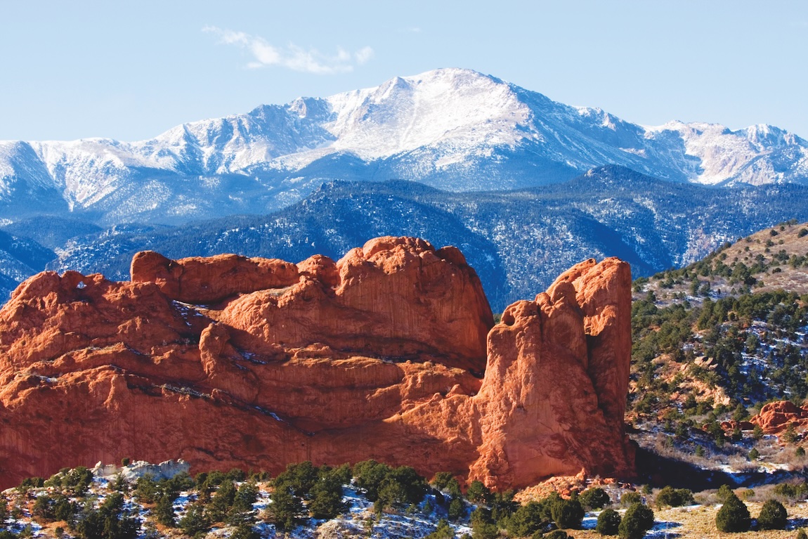 Snow covered Garden of the Gods Park in Colorado Springs at the base of 14,000 foot Pikes Peak in the wintertime.