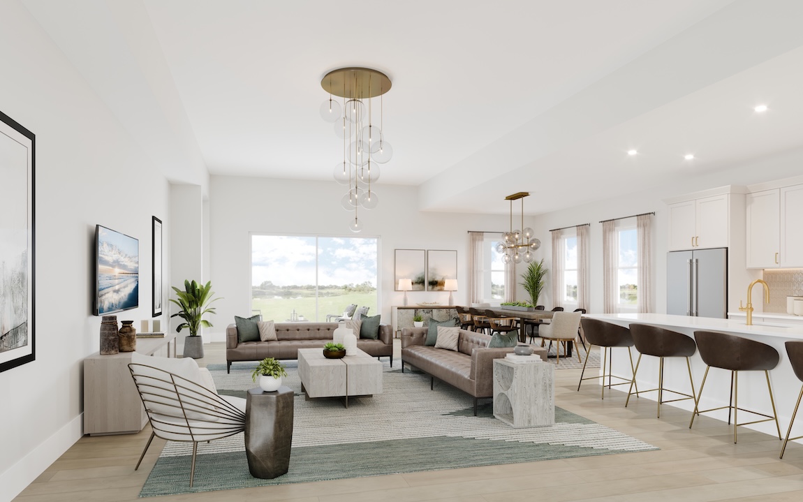 Open-concept living room and kitchen with leather sofas, brass-accent lighting, large windows, and neutral layered textures.