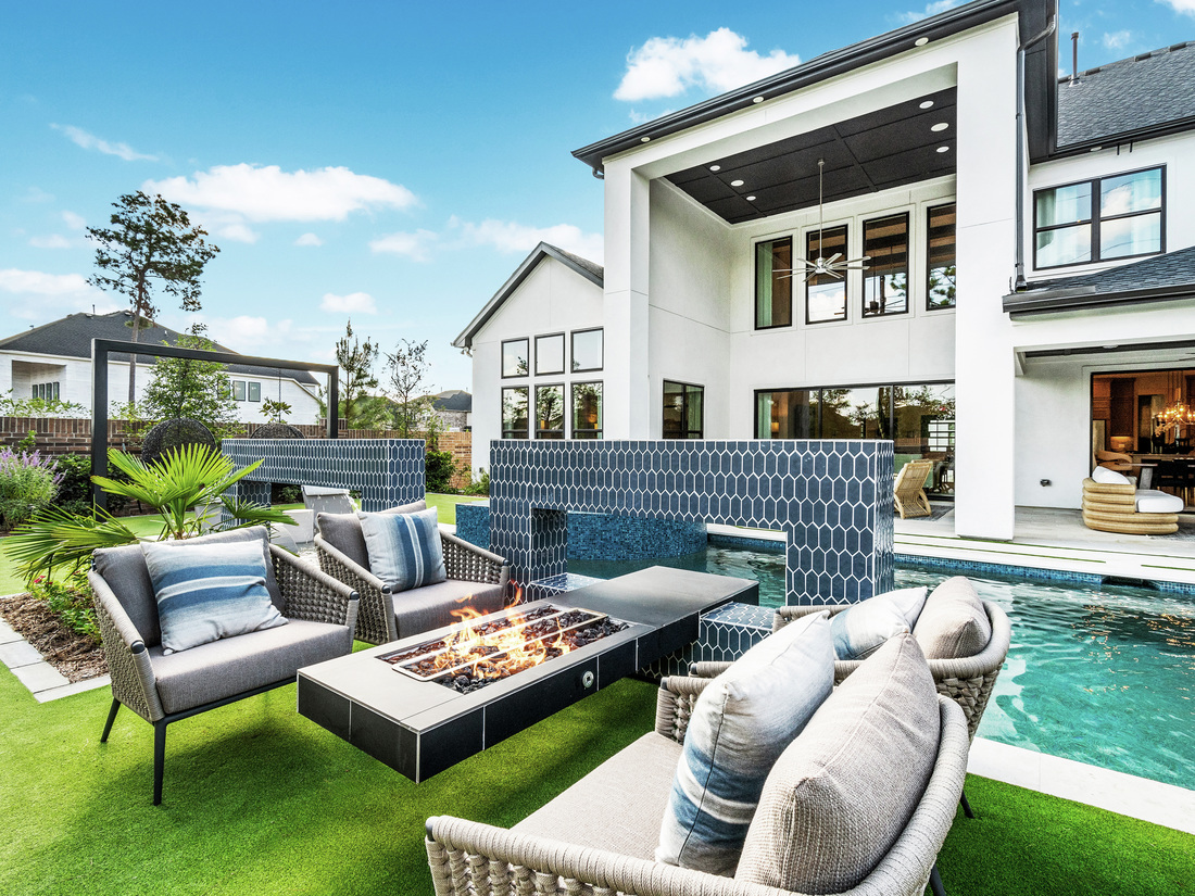 modern outdoor living space with pool and firepit