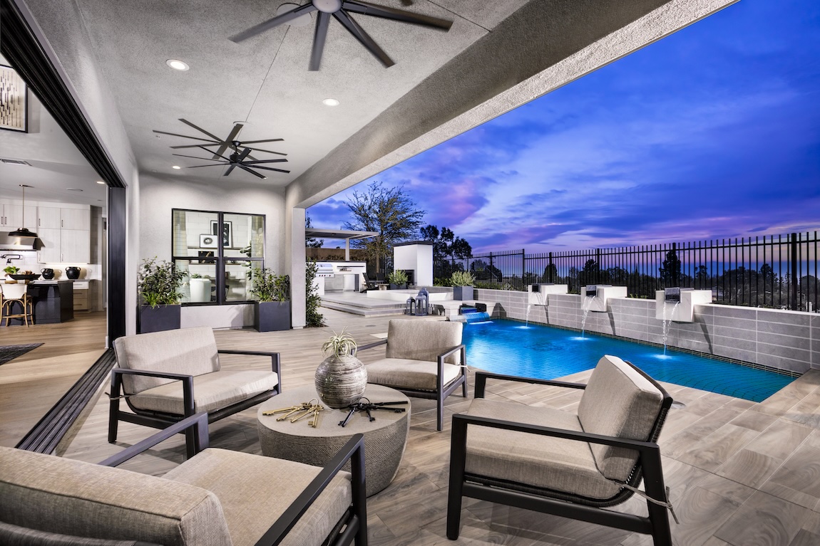 outdoor living space with pool and seating spaces