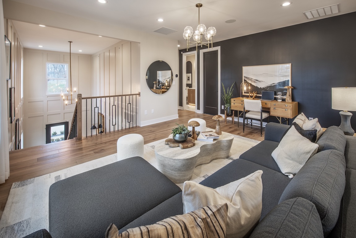 luxury loft space with couch and desk